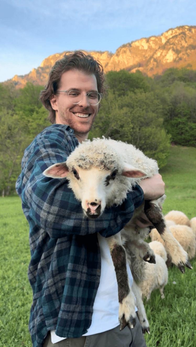 Nedim with farm animals on homestead