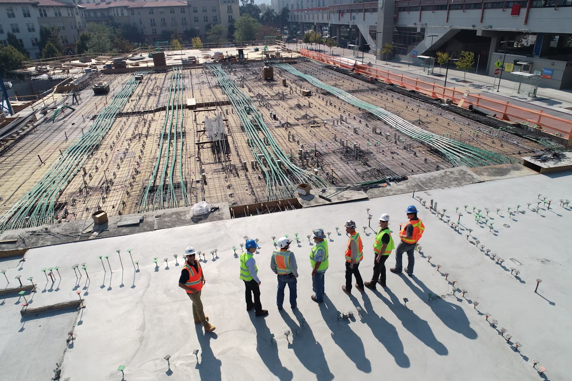 Construction team meeting on a building site to review plans